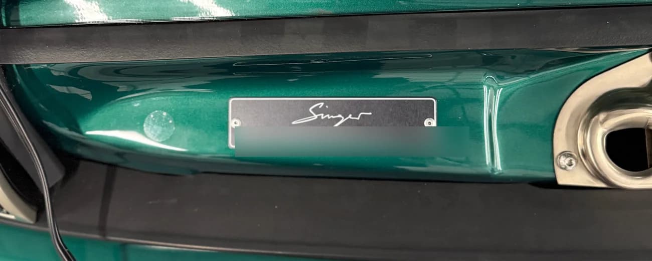 The Singer commission plate, riveted under the boot lid
