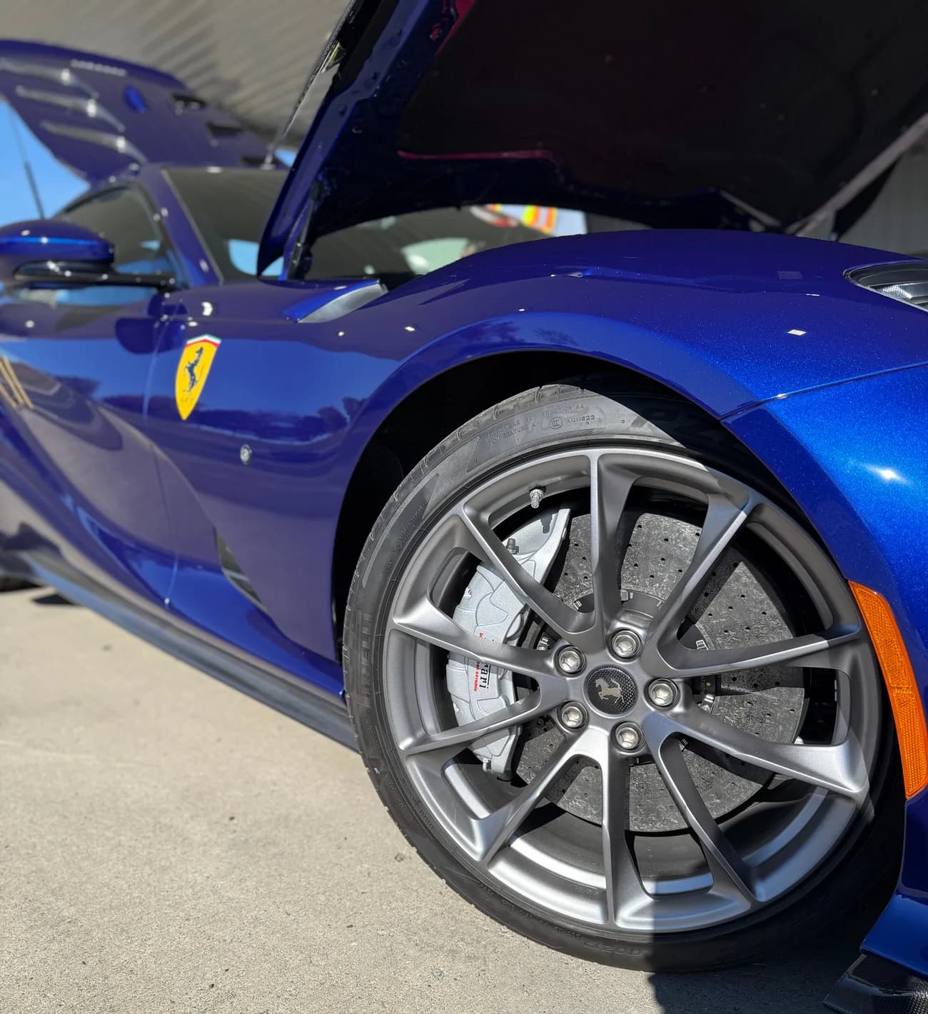 A forged wheel and carbon ceramic brake rotor, low angle