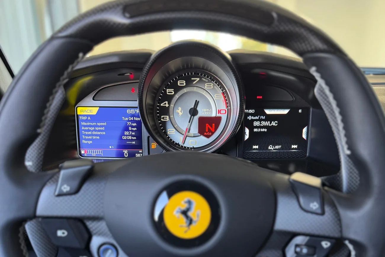 A closer view of the instrument cluster and its white-faced tachometer